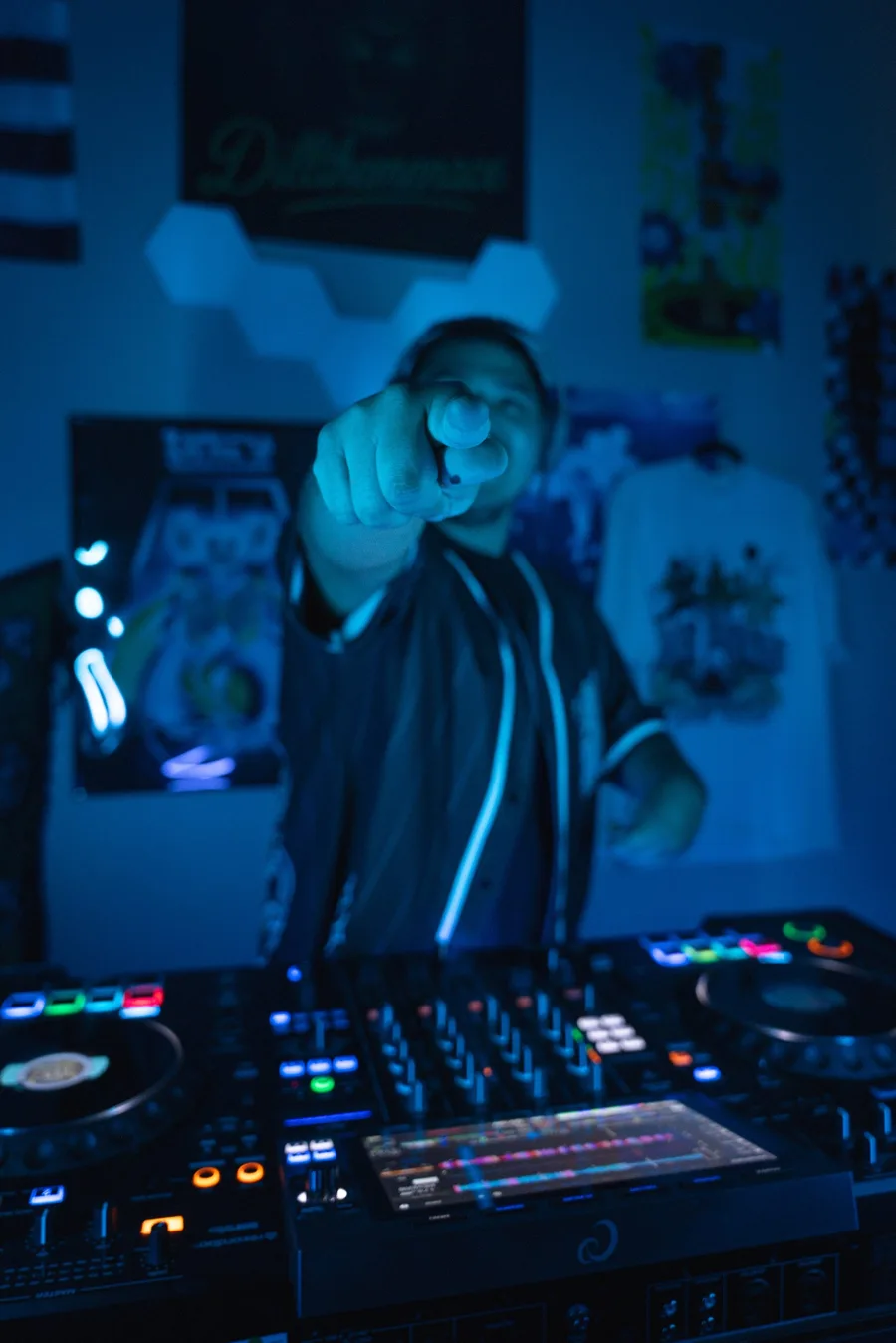 Focused on the mix behind the DJ controller