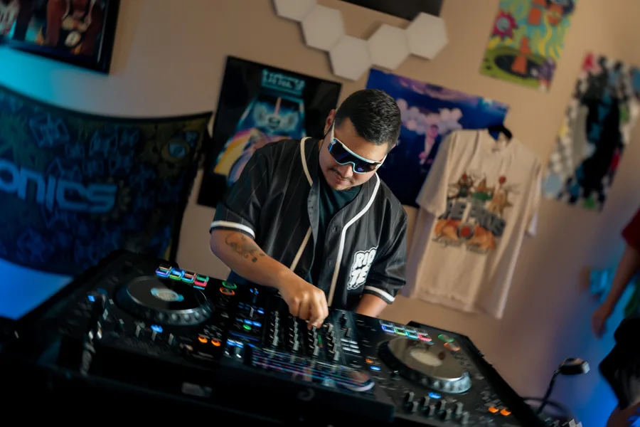 Full DJ setup with controller and blue lighting