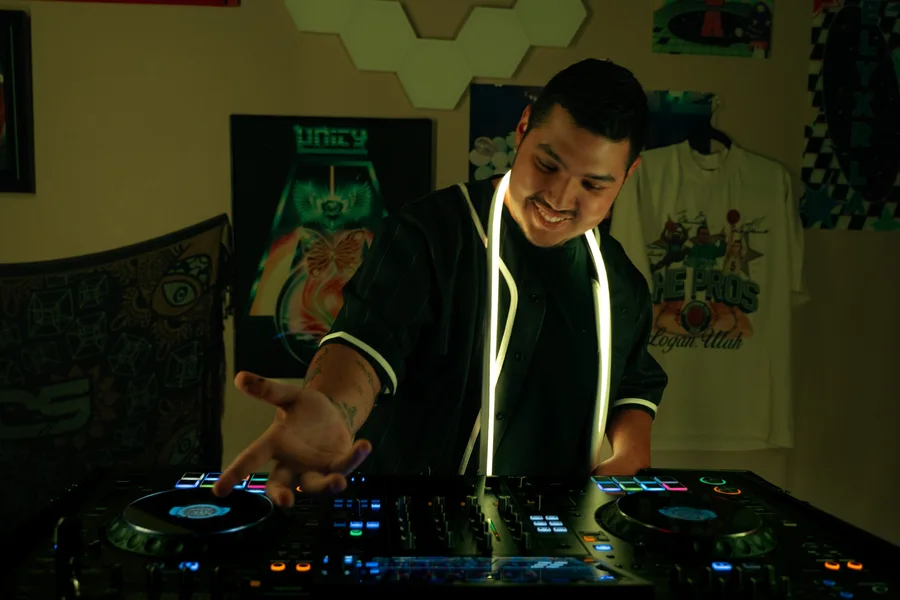 Dill the Menace at the decks with warm amber lighting